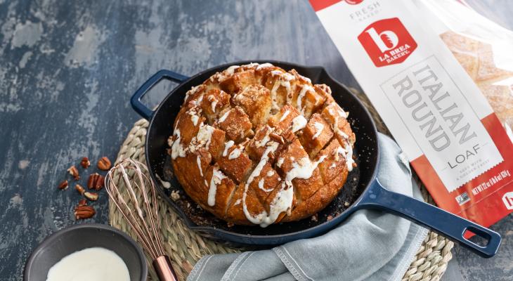 Sweet Skillet Pull-Apart witb Brown Sugar Butter and Glaze in a Skillet with an Italian Round Loaf