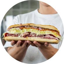 Close-up of hands holding a sandwich