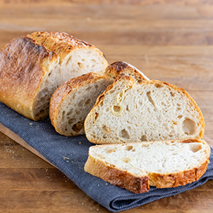 Roasted Garlic Loaf sliced on a tray