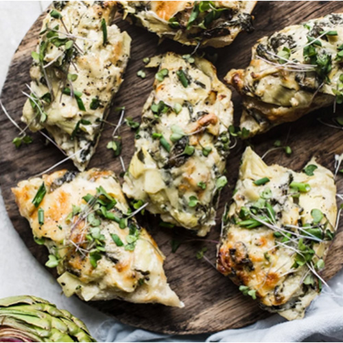 Overhead of spinach artichoke dip bread