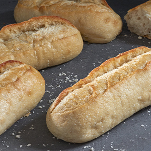 Four Demi Sourdough Baguettes on a tray