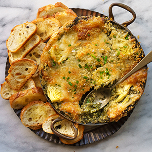 Spinach and Artichoke Dip with slices of French Baguette
