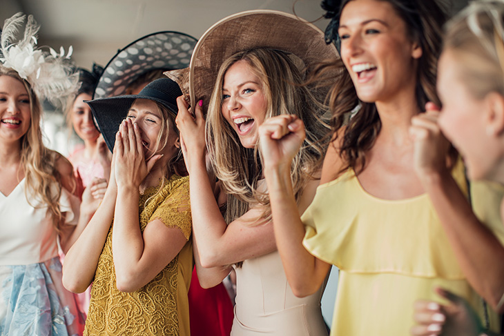 Group of young ladies enjoying the Kentucky Derby party at home