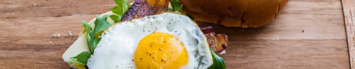 Brioche breakfast sandwich with maple bacon glaze