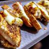 Grilled cheese sandwich halves on a tray
