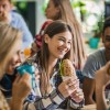 Group of school children eating healthy sandwiches