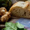 Roasted Garlic Loaf Next to Garlic