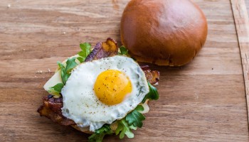 Brioche breakfast sandwich with maple bacon glaze