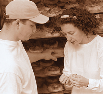 Two LBB employees in discussion in the bakery