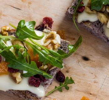 Grilled Cheese Board Sandwich with Brie, Arugula, Honey and Trail Mix
