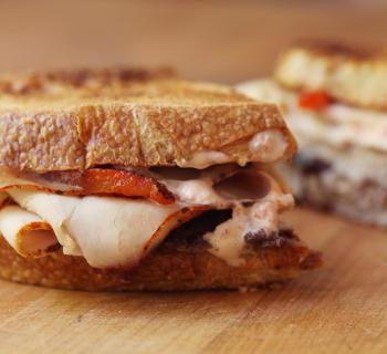 Turkey Melt with Olive, Tomato and Roasted Pepper Mayonnaise