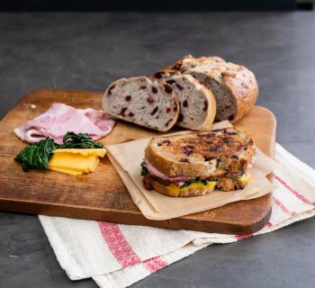 Maple Glazed Ham and Greens Grilled Cheese on Cranberry Walnut Loaf