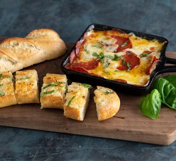 Molten Pepperoni Cheese Dip With Garlic Bread