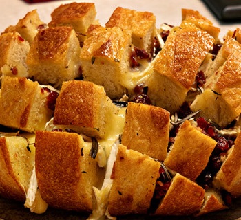 Cooked loaf of cranberry and brie pull-apart bread 